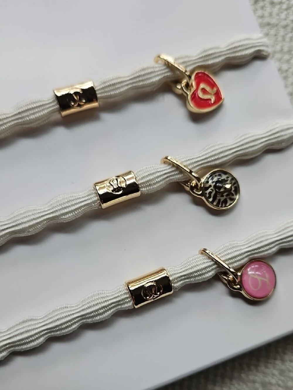 lululemon athletica Charm Hair Ties Trio — White Bands with Red & Pink Charms